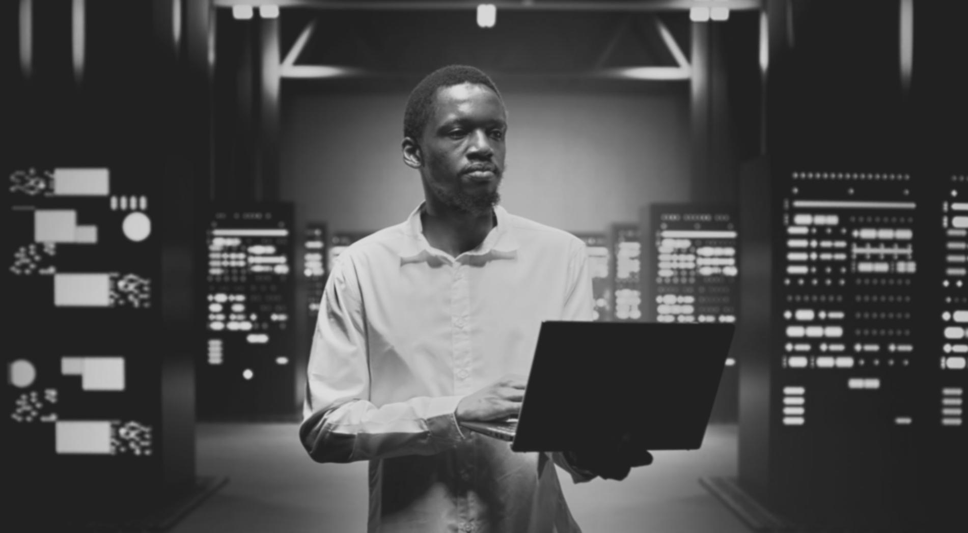 Developer reviewing smart contract code on multiple monitors in modern office environment